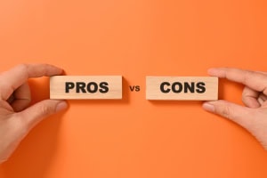 Pros and cons text on wooden blocks, Advantages and disadvantages for business management, Personal perspective, Concept of positive or negative decision making or choice of approval or rejection