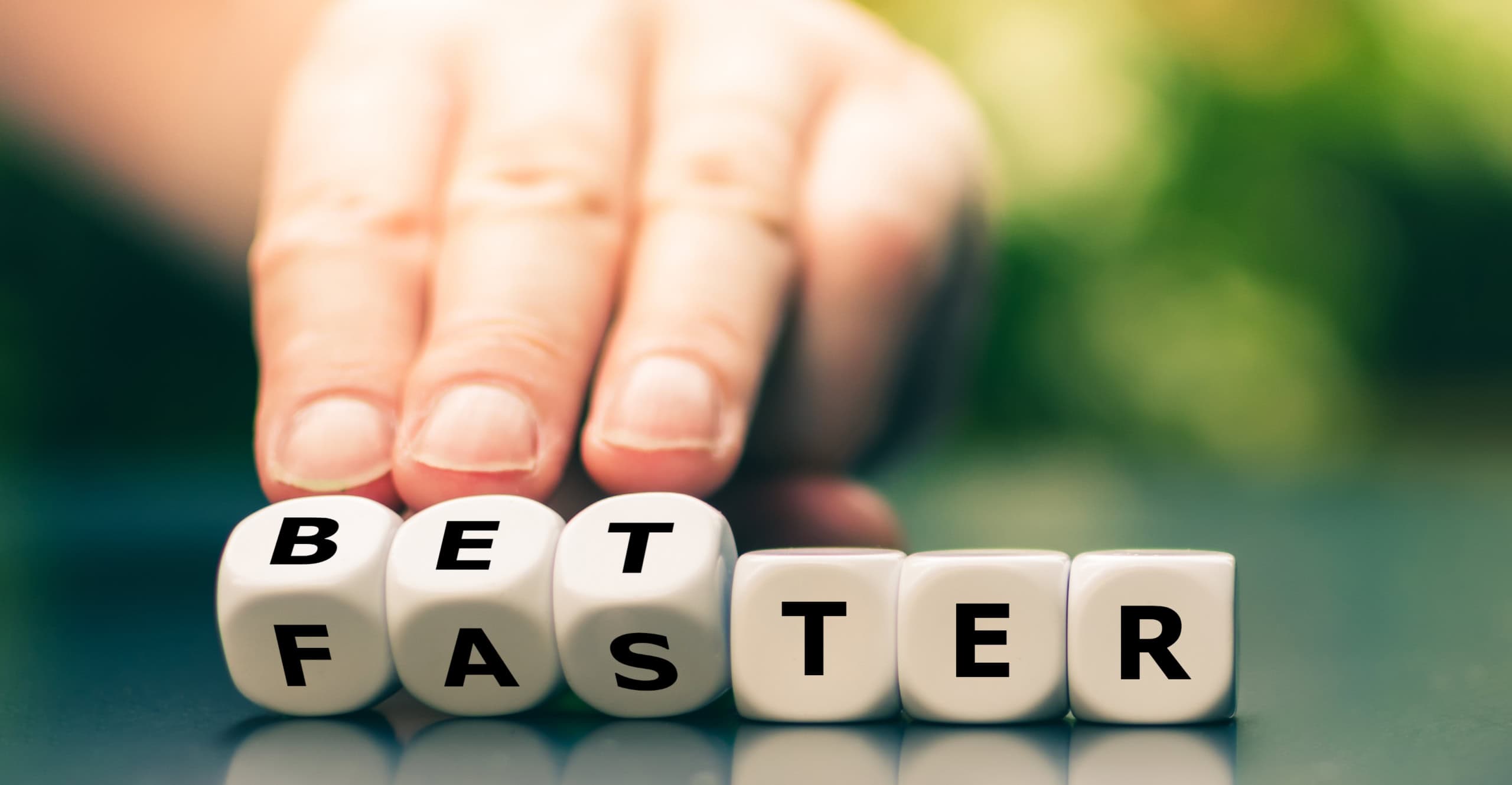 Symbol for better work instead of faster work Hand turns dice and changes the word "faster" to "better"